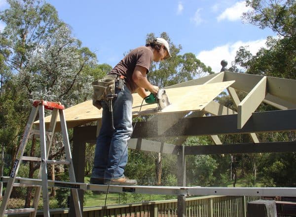 Cutting the plywood up the centre of the rafter carefully