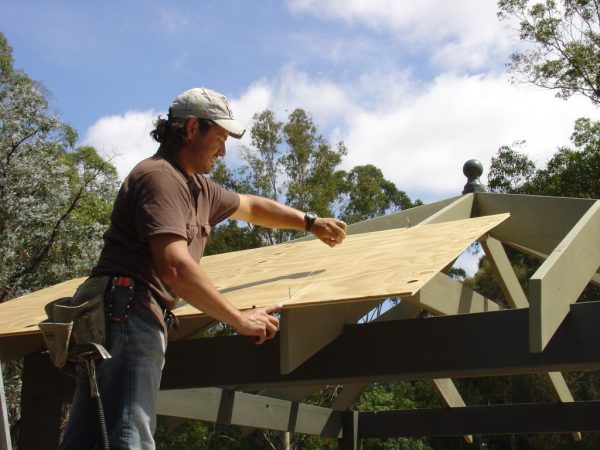 Snapping a Chalk line for cutting up the centre rafter of the outdoor gazebo